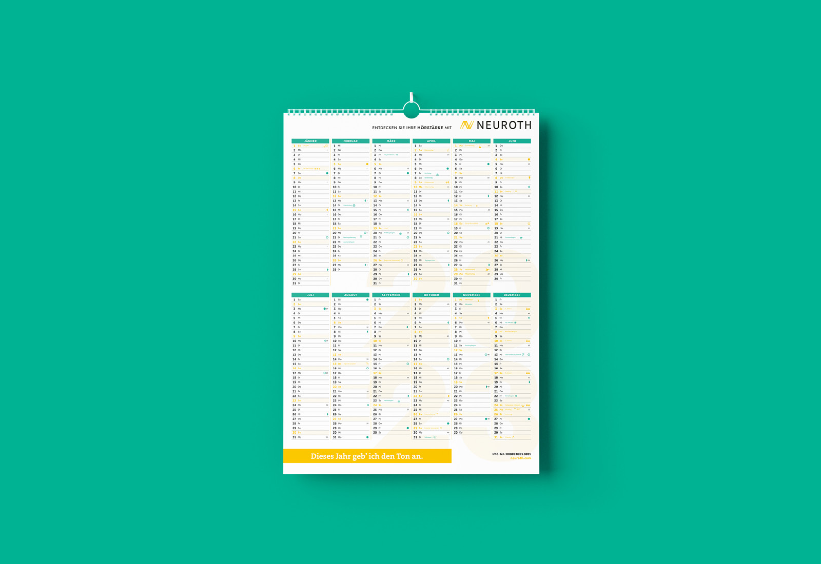 A calendar hanging on a green background.
