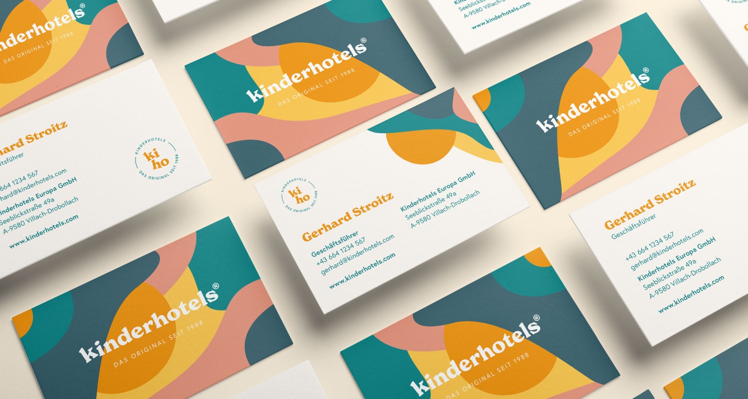 A set of Kinderhotels business cards with different shapes and colors.