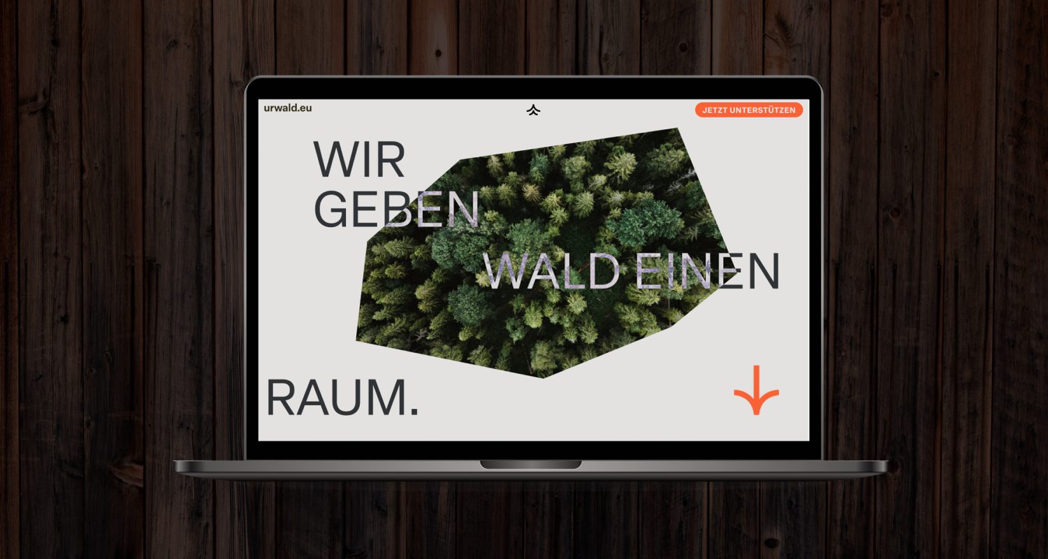 A laptop with the website urwald.eu displayed on its screen.