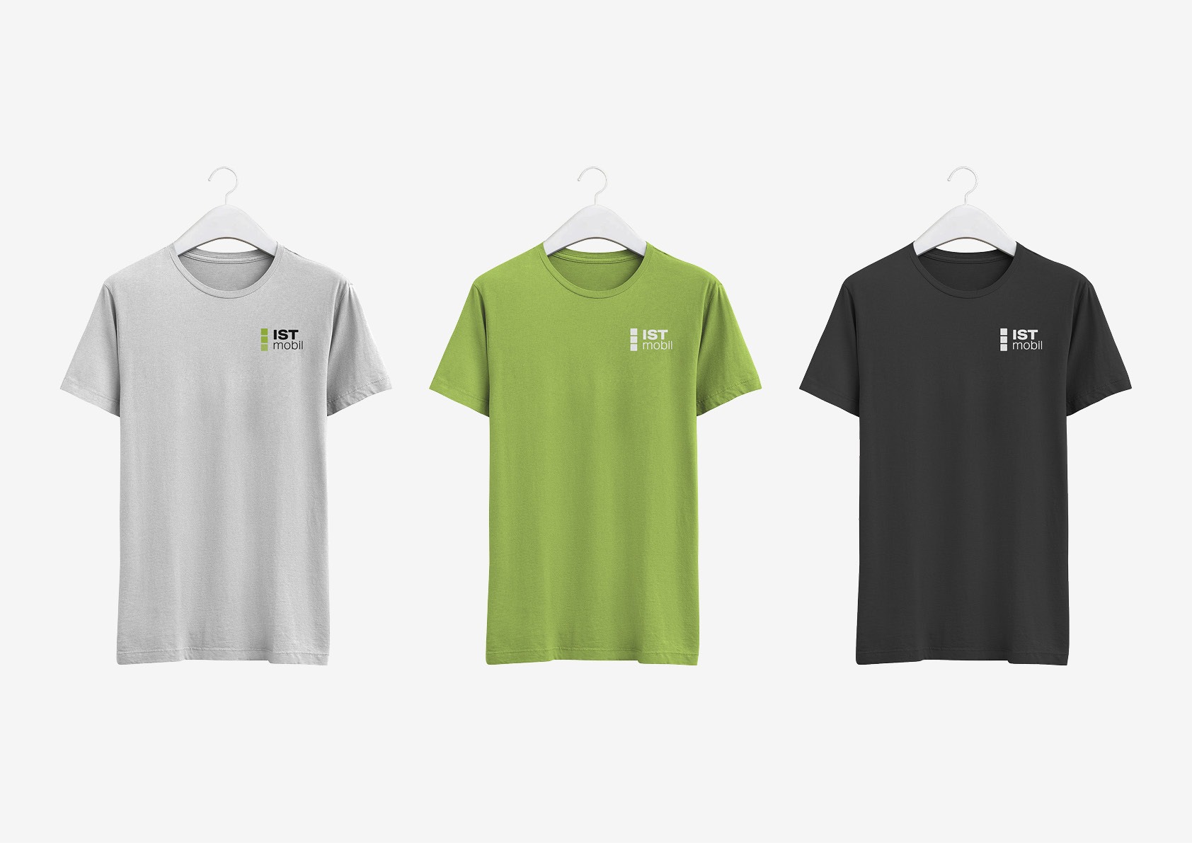 Three t-shirt mockups on a white background showcasing ISTmobil designs.