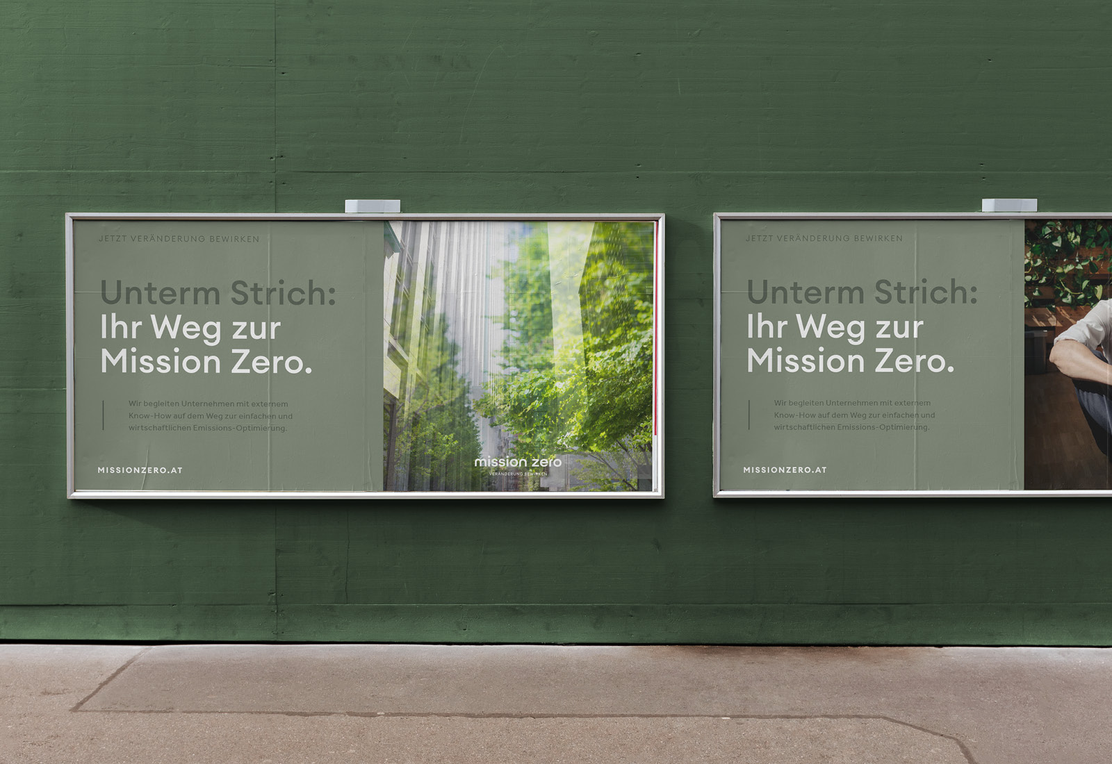 Two billboards promoting Mission Zero on the side of a green wall.