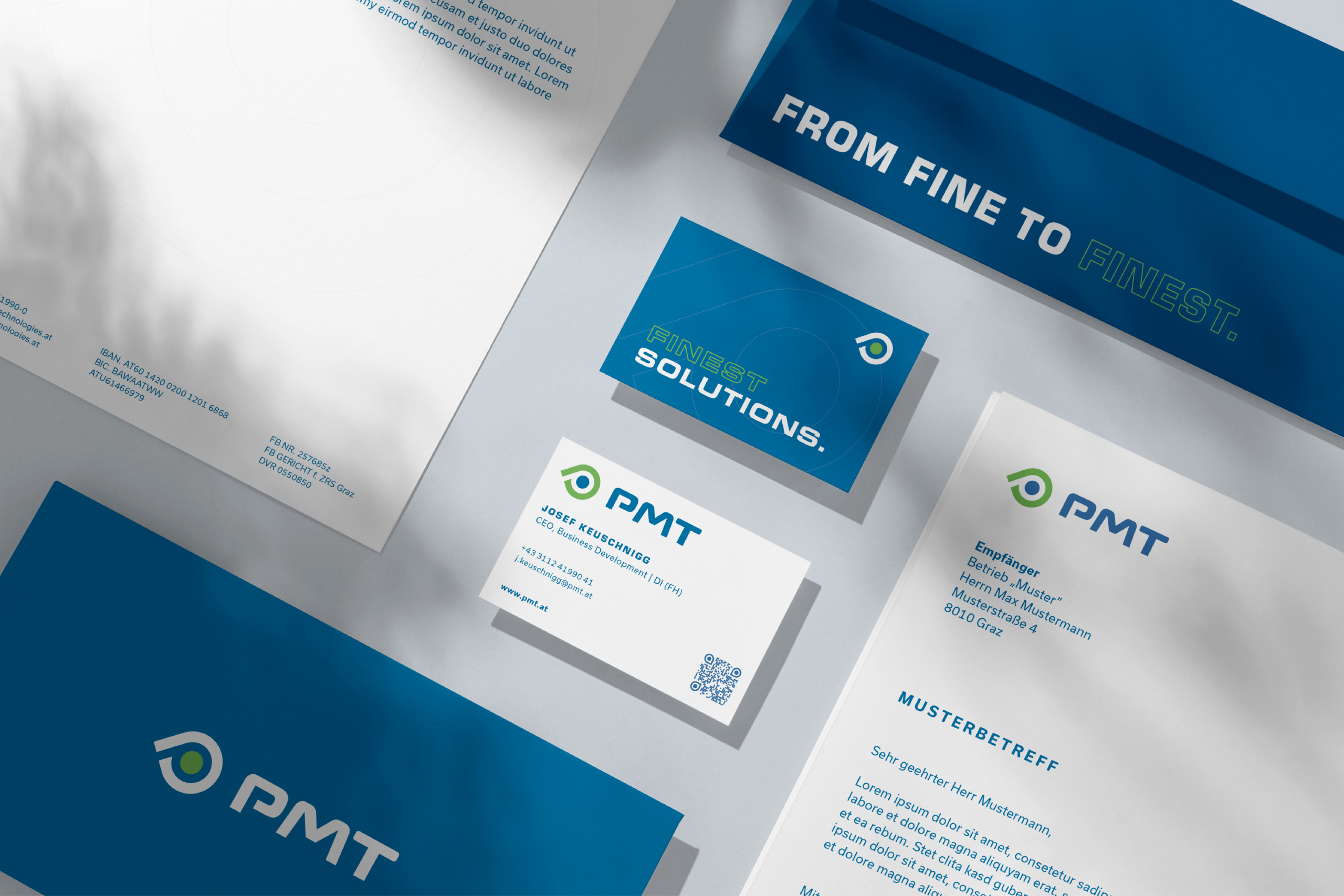 A business card, letterhead and business cards for PMT.