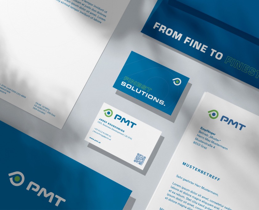 A business card, letterhead and business cards for PMT.