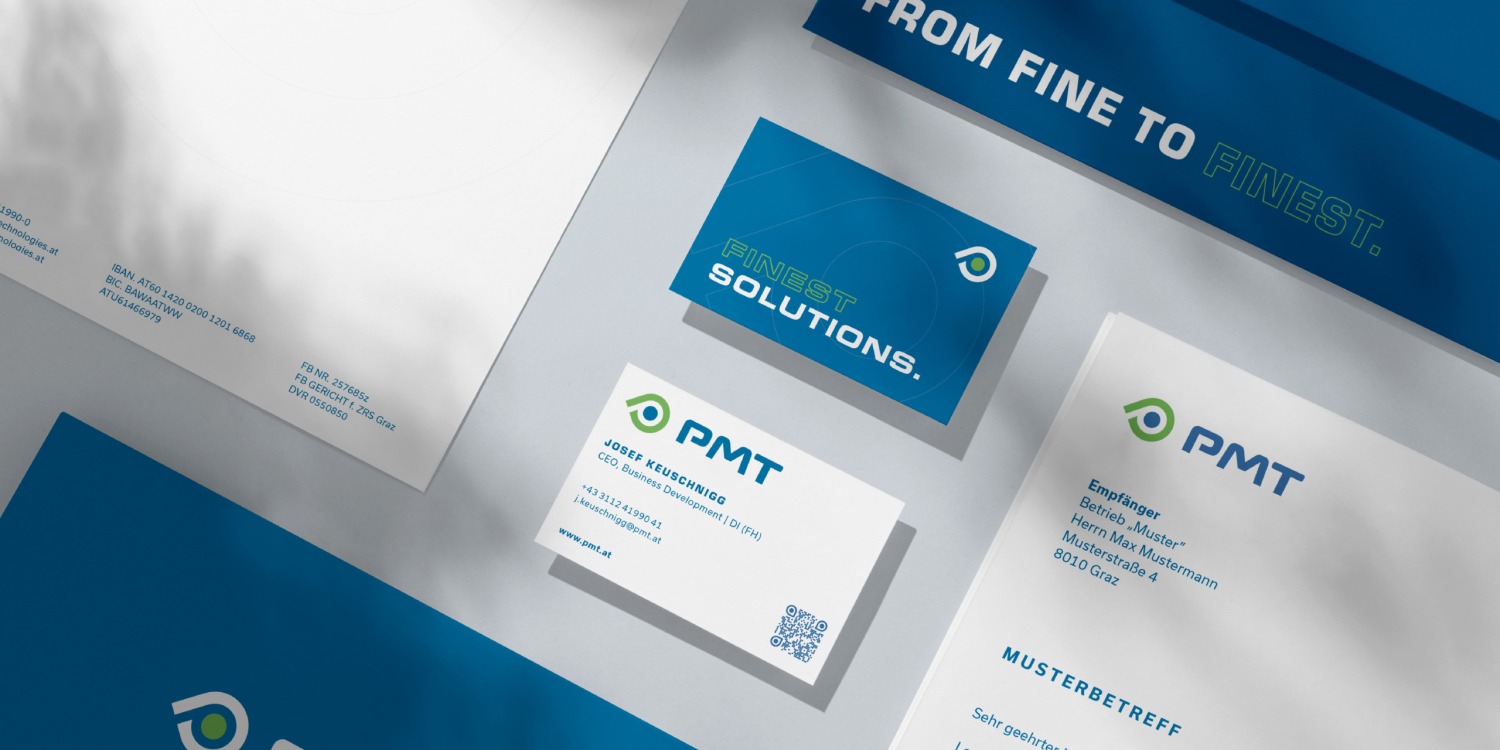A business card, letterhead and business cards for PMT.