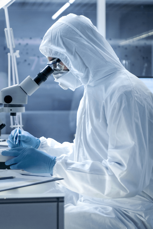 Two people in white lab coats working in a laboratory.